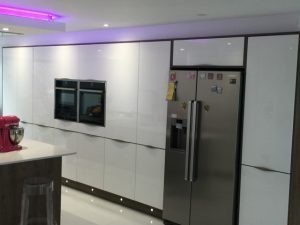 silver fridge with magnets