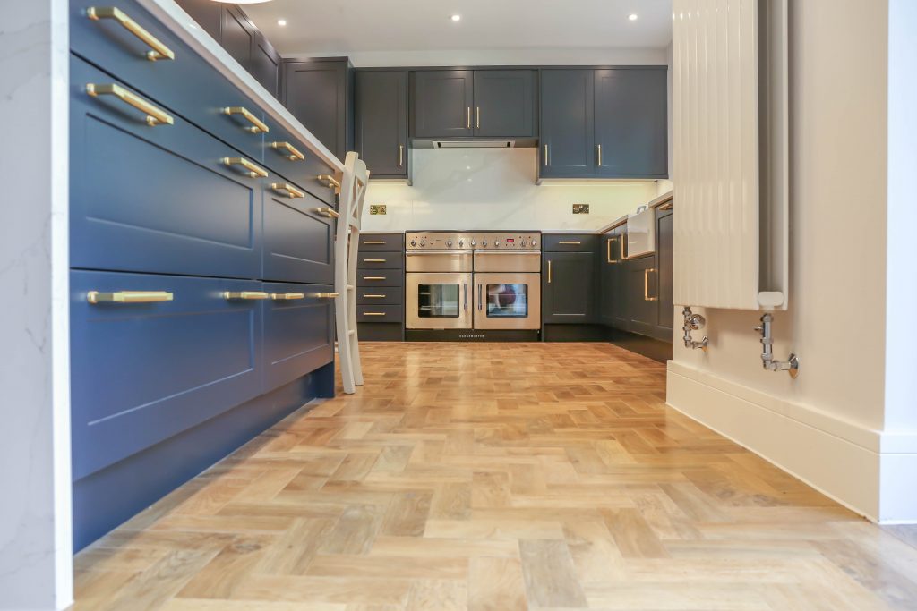 blue kitchen with double oven