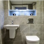 grey marble bathroom with white sink and toilet