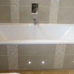 grey and white bath with spotlights