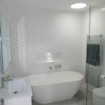 white abstract walks with glass shower door