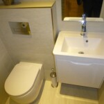 toilet and sink next to eachother