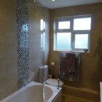 window in bathroom with towel rail underneath
