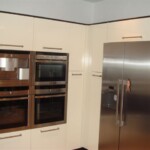 built in ovens with silver fridge
