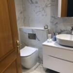 brown door open to show bathroom