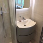 close up of bathroom sink with mirror