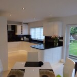 kitchen and dining room with black sofa