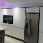 silver fridge with magnets