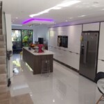 long kitchen next to stairs