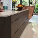 brown and white kitchen with metal chair