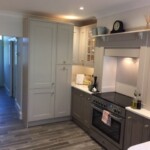 long kitchen with grey and white detials