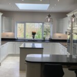 black sparkly worktop in white kitchen