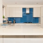 white kitchen with blue walls