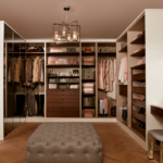 Luxury bespoke walk-in wardrobe with shelving, drawers, and dressing area