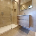 simple bathroom with shower and sink
