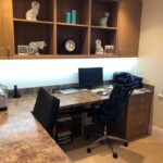 office with shelves above desk chair