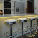 breakfast bar in kitchen with rounded stools