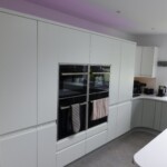 white and light grey kitchen with spot lights