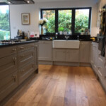 wooden flooring in grey kitchen