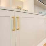 white with golden handles cabinets