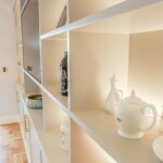 white shelving units with ornaments