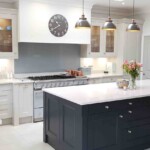 white and black kitchen with brown lights
